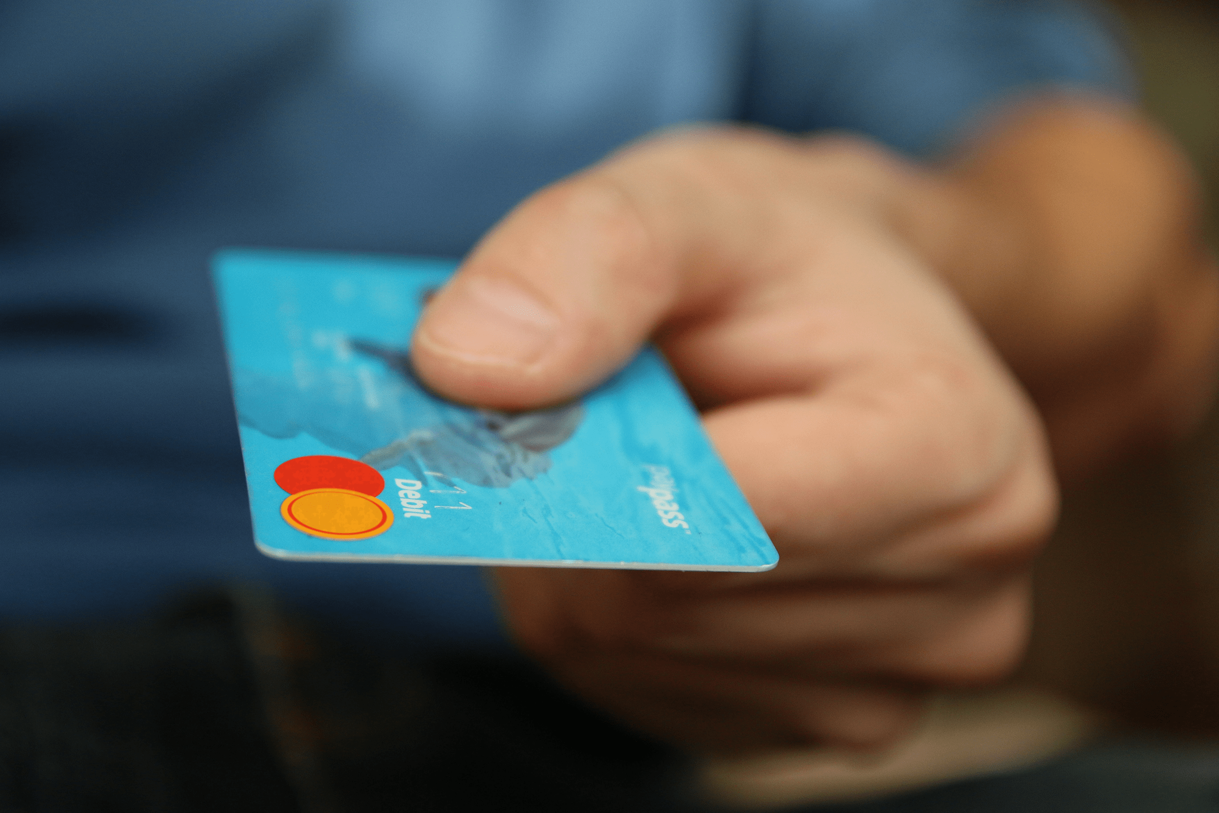 Close-up of hand using credit card