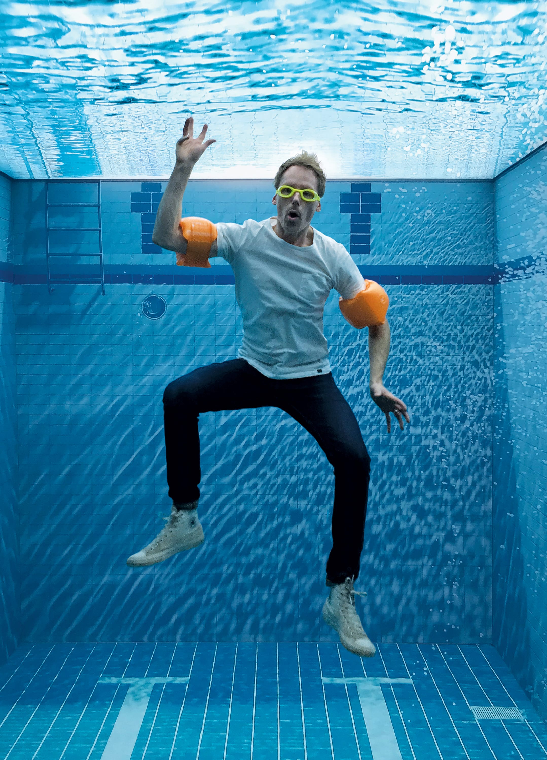 Internal engagement - optical illusion selfie pool - man under water with arm bands