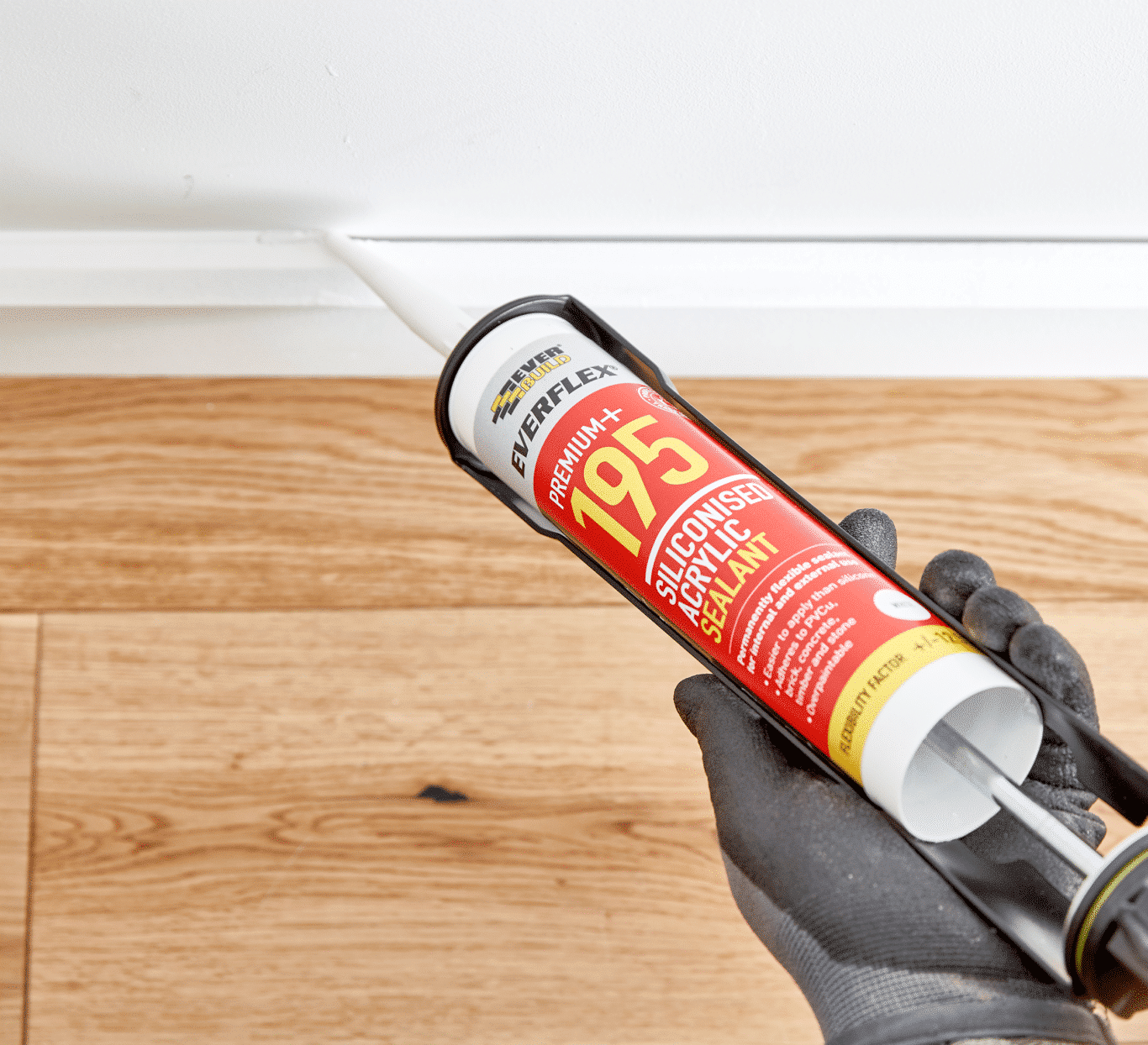 Everbuild Everflex Siliconised Acrylic Sealant being applied to skirtingboard — Everbuild Everflex Packaging Design