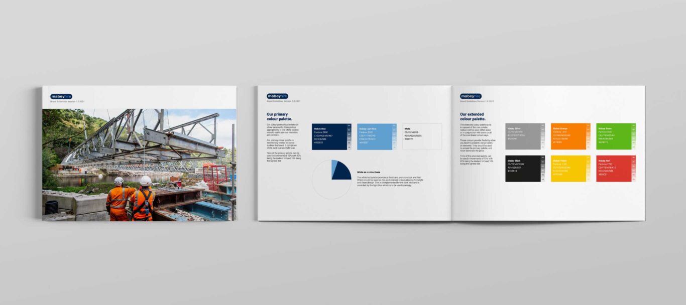 Front cover and double page spread of the Mabey brand guidelines showing the brand colours